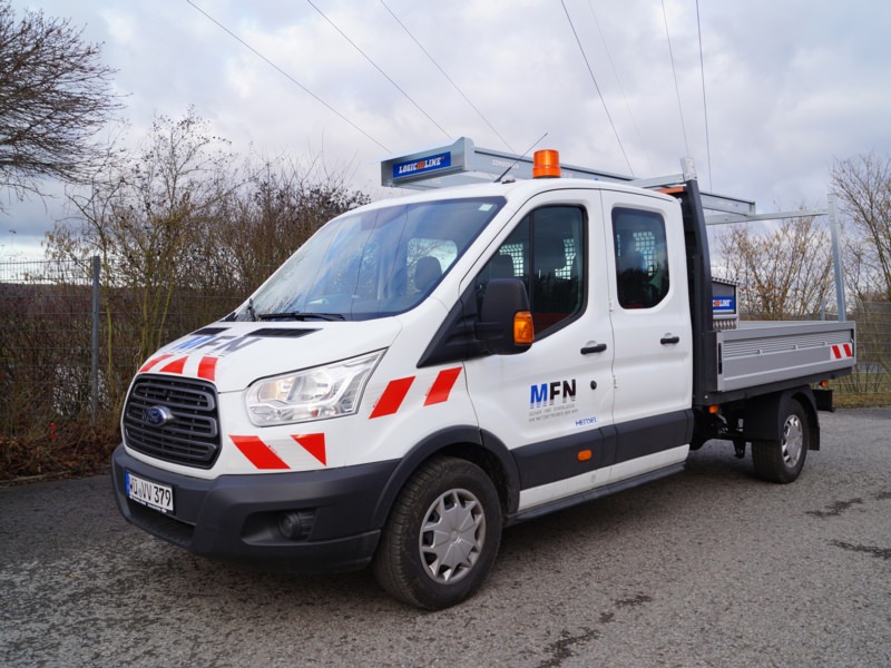 Umbau Pritsche - Mainfranken Netze Würzburg, Ort/Kunde: Mainfranken Netze GmbH, Fahrzeug: Ford Transit, Typ: Pritschenaufbau - HENSEL Fahrzeugbau - Auslieferung Kundenfahrzeug